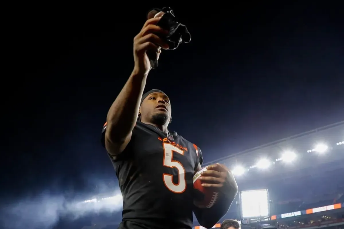 Nov 5, 2023; Cincinnati, Ohio, USA; Cincinnati Bengals wide receiver Tee Higgins (5) hands his gloves to fans after the victory over the Buffalo Bills at Paycor Stadium. credits: Katie Stratman-USA TODAY Sports