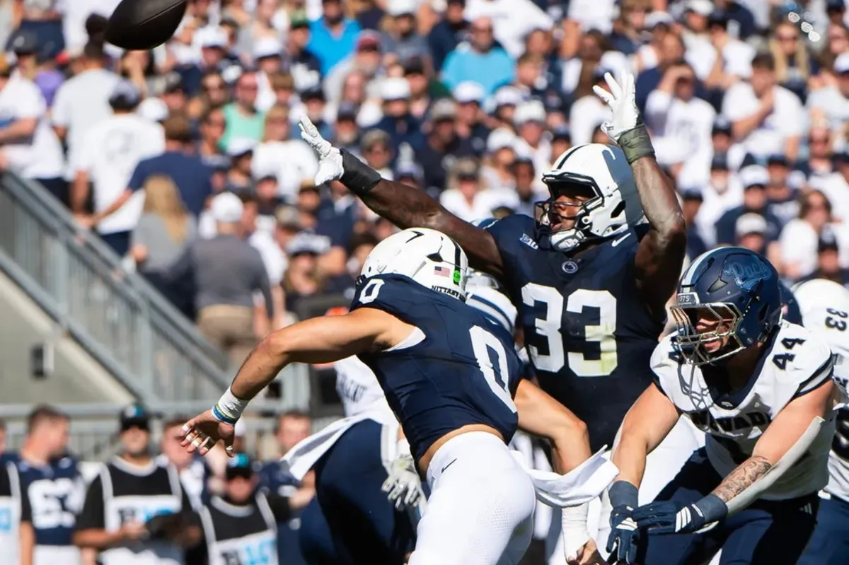 Penn State's Dani Dennis-Sutton (33) reaches for the ball as he attempts to block a punt in the first half of an NCAA football game against Nevada, Saturday, August 30, 2025, in State College, Pa.
