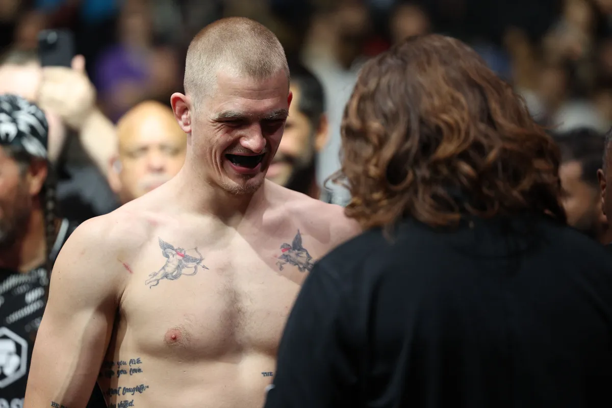 Apr 26, 2025; Kansas City, Missouri, UNITED STATES; Ian Machado Garry (red gloves) prepares to fight Carlos Prates (not pictured) during UFC Fight Night at T-Mobile Center. Mandatory Credit: William Purnell-Imagn Images
