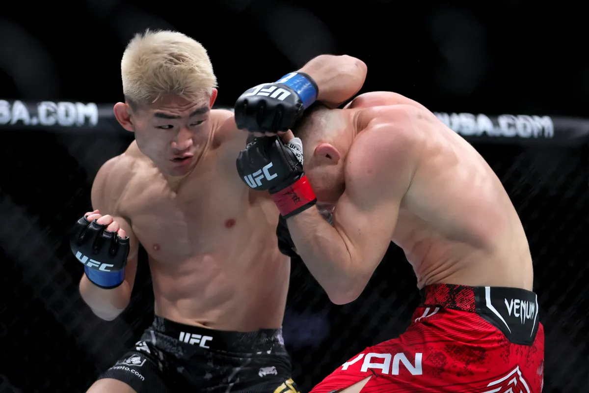 Mar 9, 2024; Miami, Florida, USA; Song Yadong (blue gloves) fights Peter Yan (red gloves) during UFC 299 at Kaseya Center. Mandatory Credit: Sam Navarro-USA TODAY Sports