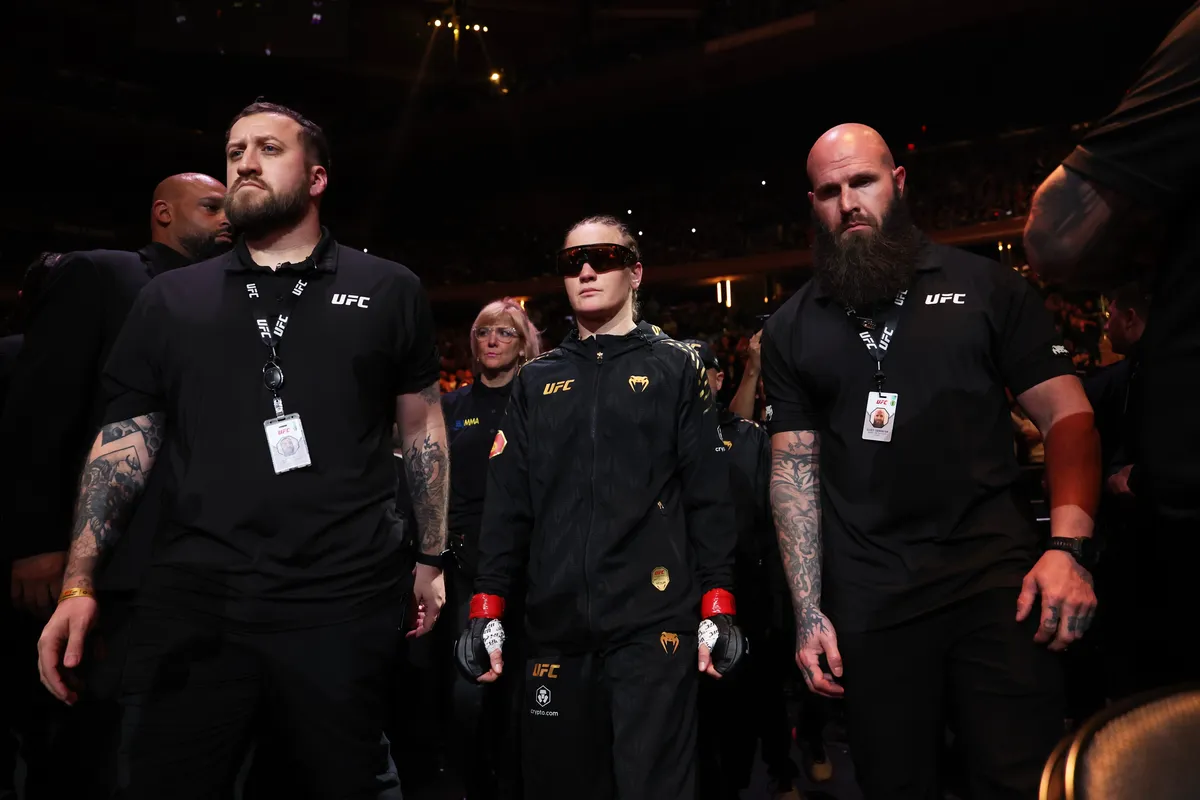 Nov 15, 2025; New York, NY, UNITED STATES; Valentina Shevchenko (red gloves) walks out before the womens flyweight championship bout against Zhang Weili (not pictured) during UFC 322 at Madison Square Garden. Mandatory Credit: Ed Mulholland-Imagn Images