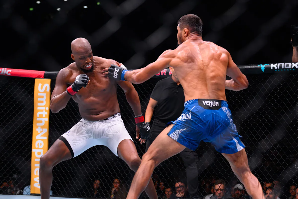 Sep 5, 2026; Paris, FRANCE; Michael Venom Page (red gloves) fights Nursulton Ruziboev (blue gloves) during UFC Fight Night at Accor Arena. Mandatory Credit: Per Haljestam-Imagn Images