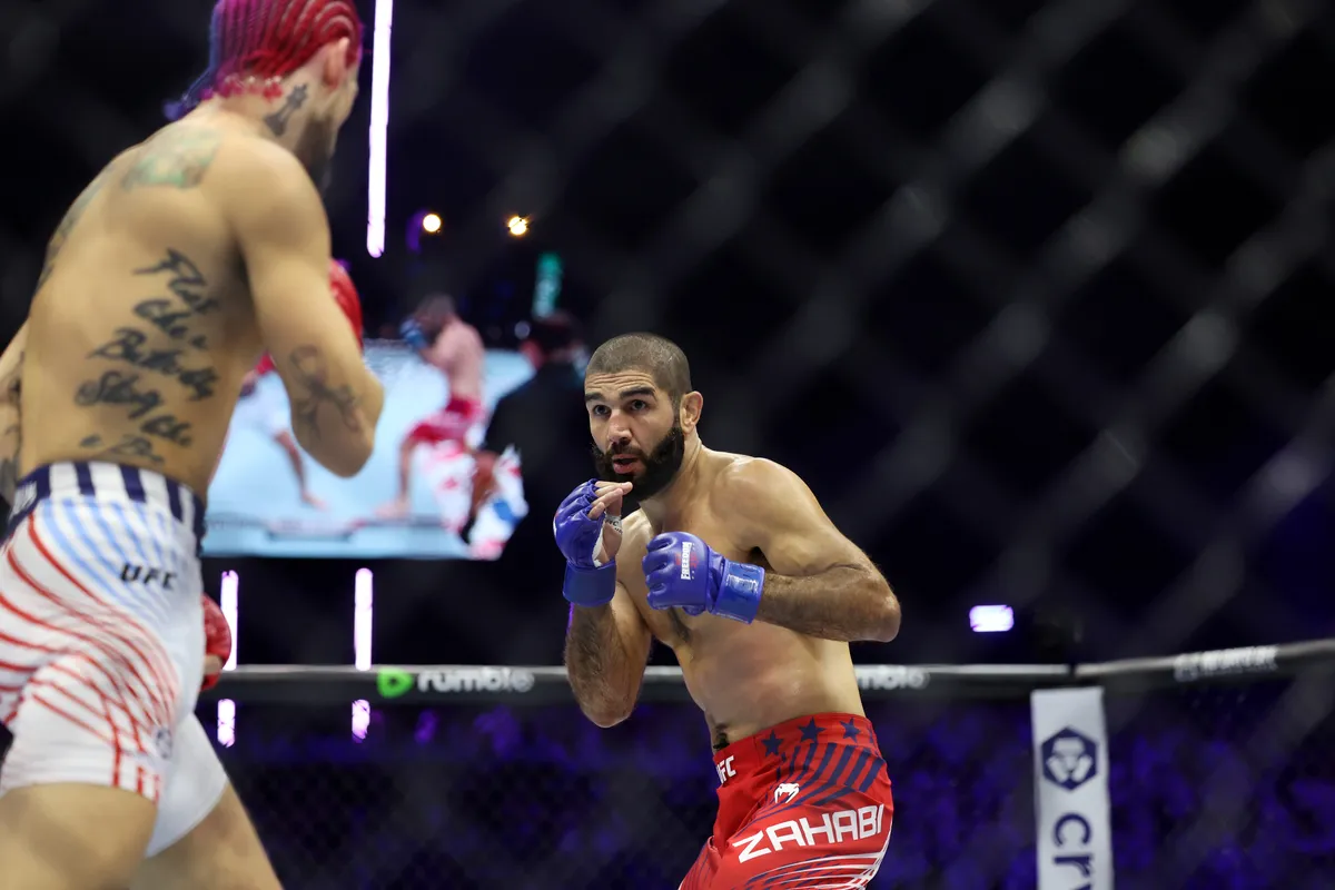 Jun 14, 2026; Washington, D.C., USA; Aiemann Zahabi (blue gloves) fights Sean O'Malley (red gloves) during UFC Freedom 250 at White House South Lawn. Mandatory Credit: Amber Searls-Imagn Images