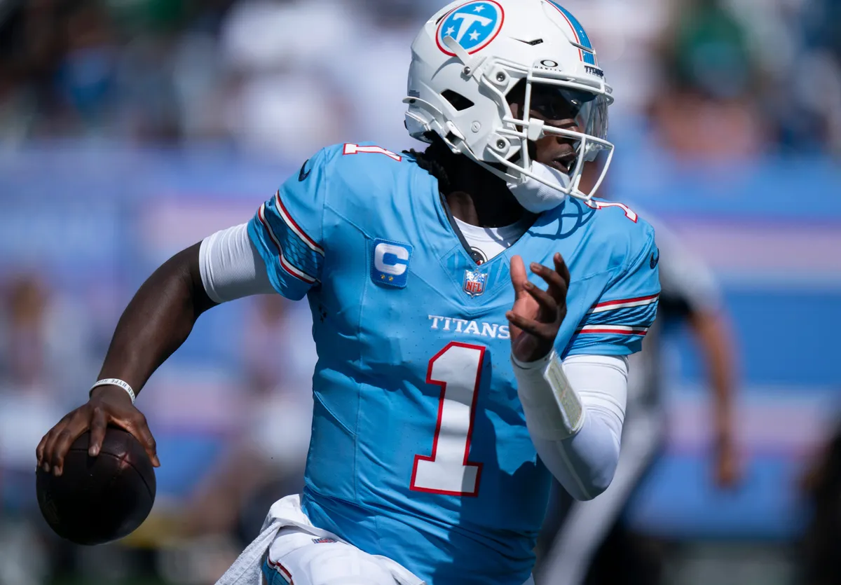 Tennessee quarterback Cam Ward (1) scrambles under New York’s pressure during their season opener at Nissan Stadium Sunday, Sept. 13, 2026.