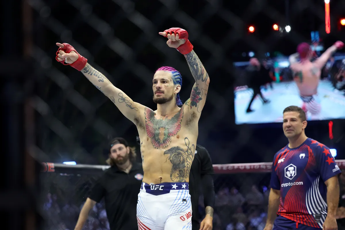 Jun 14, 2026; Washington, D.C., USA; Sean O'Malley (red gloves) celebrates after winning against Aiemann Zahabi (not pictured) during UFC Freedom 250 at White House South Lawn. Mandatory Credit: Amber Searls-Imagn Images