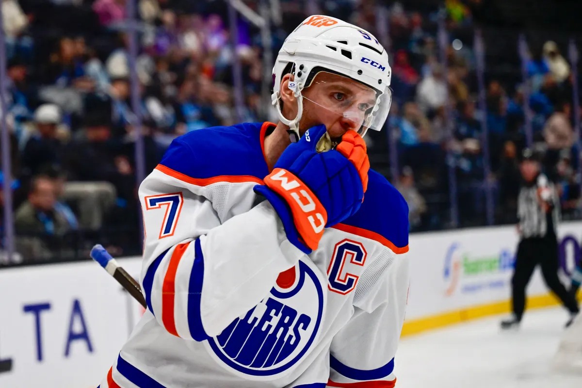 Oct 17, 2026; Salt Lake City, Utah, USA; Edmonton Oilers center Connor McDavid (97) silences the crowd after his goal during third period against the Utah Mammoth at Delta Center. Mandatory Credit: Peter Creveling-Imagn Images