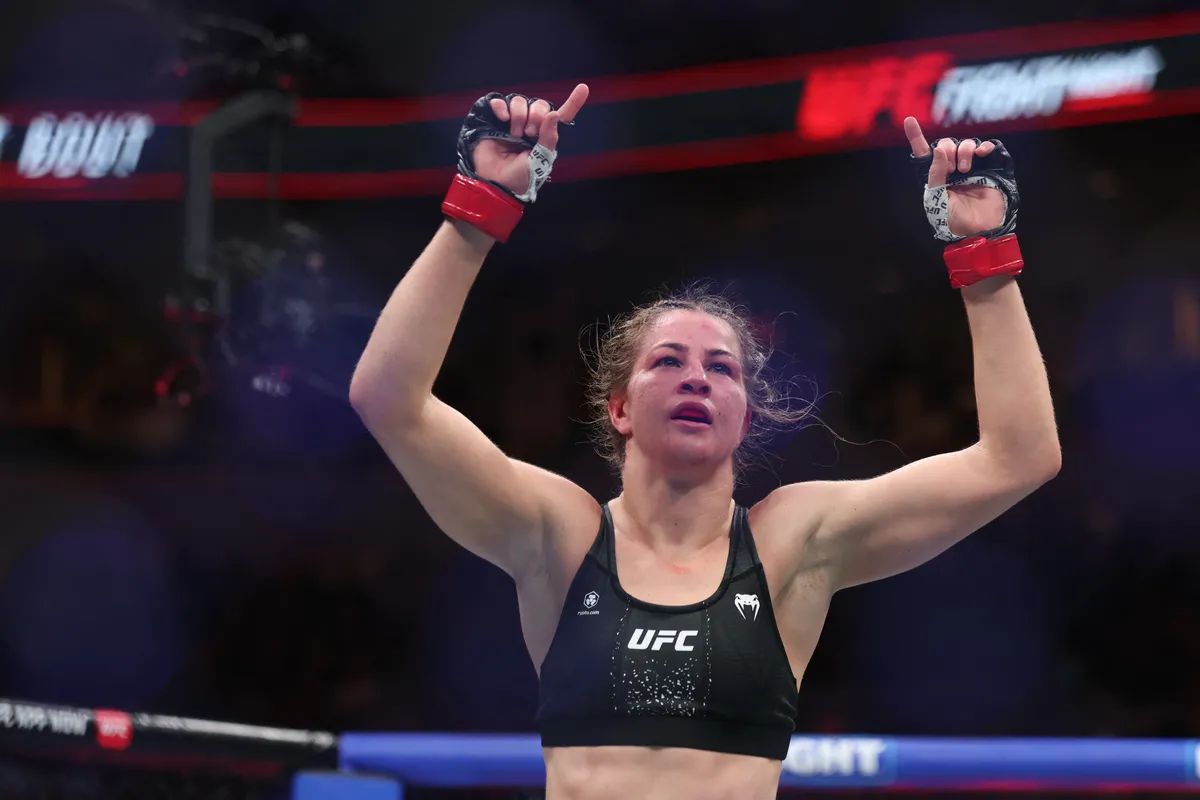 Apr 18, 2026; Winnipeg, Manitoba, CANADA; Jasmine Jasudavicius (red gloves) celebrates after the fight agasint Karine Silva (blue gloves) during UFC Fight Night at Canada Life Centre. Mandatory Credit: Bruce Fedyck-Imagn Images